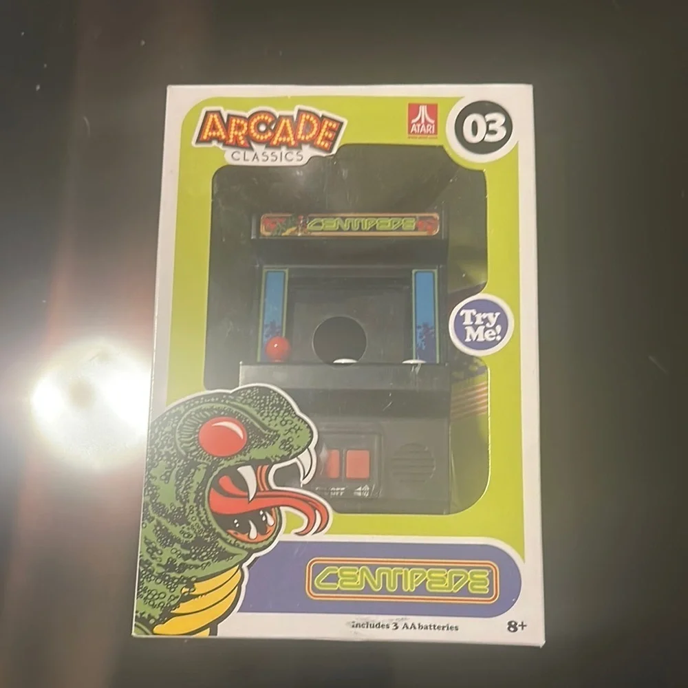 Arcade Classics Centipede hand held game.